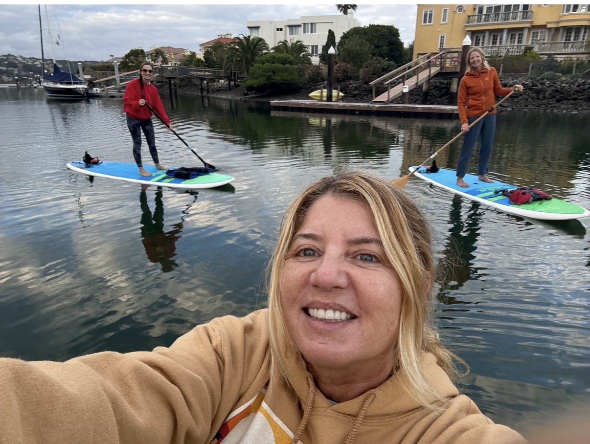 Holiday Johnson paddleboarding on the Strawberry lagoon